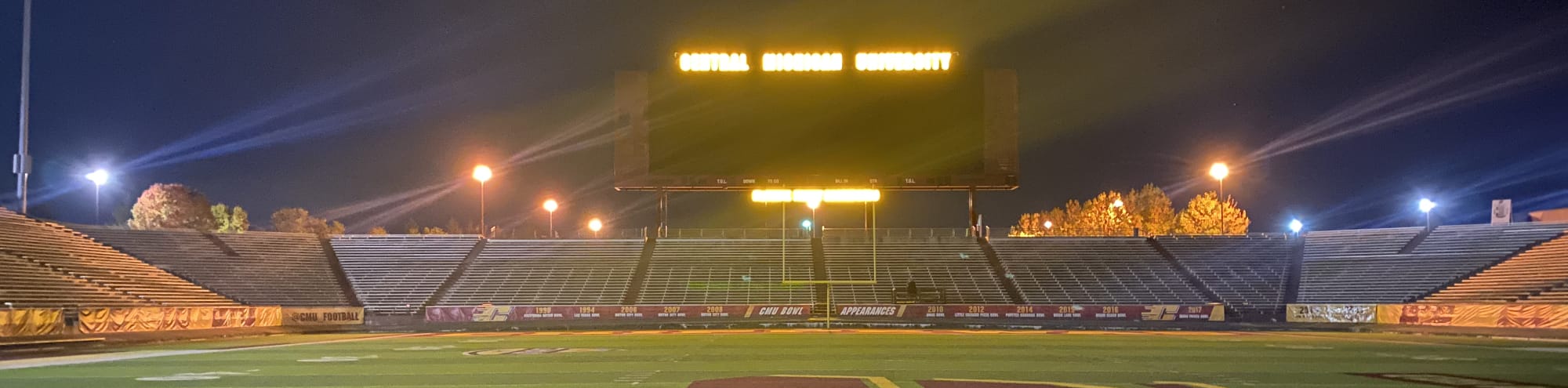 empty football stadium at night under the lights Eugene
