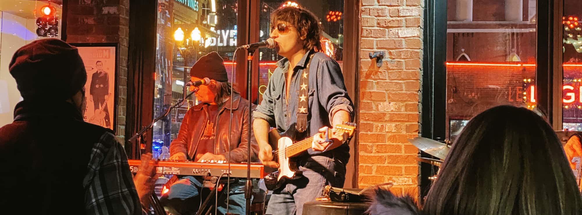 bar singer on guitar in Eugene